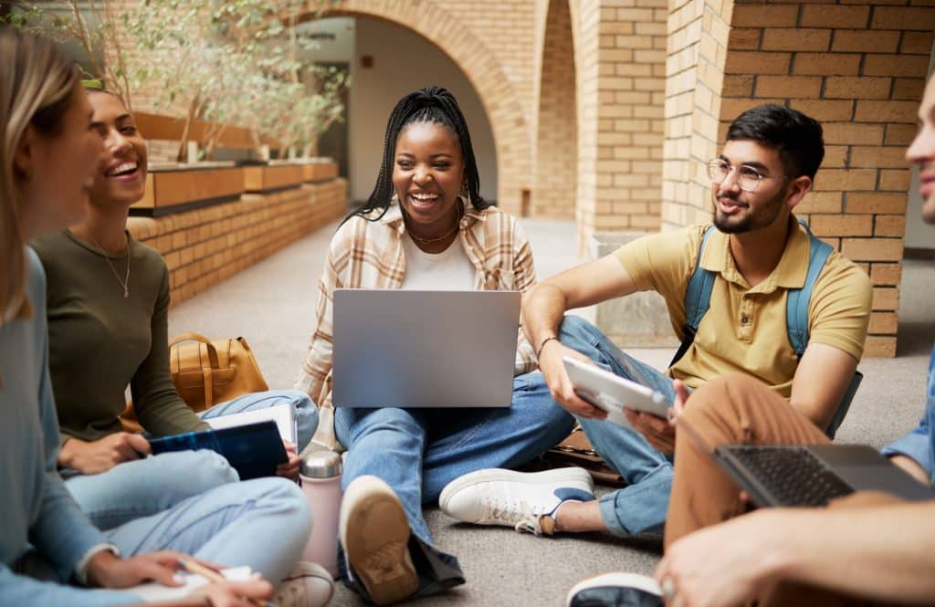 a group of young adults bonding and socializing, illustrating how community empowers individuals with ASD in young adulthood
